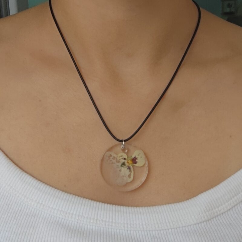Elegant Violet necklace with a violet flower-shaped pendant.