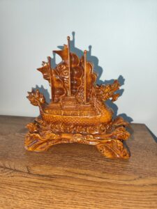 Rear view of handcrafted Feng Shui Dragon Ship figurine