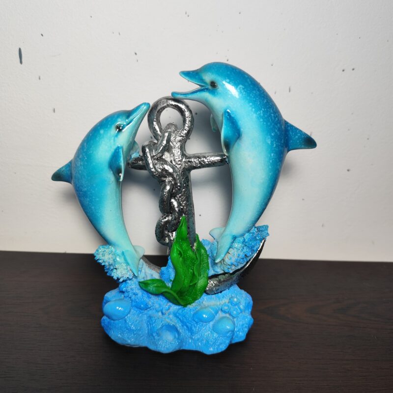 Large turquoise dolphin figurine with silver anchor and blue waves, 19 × 17 cm