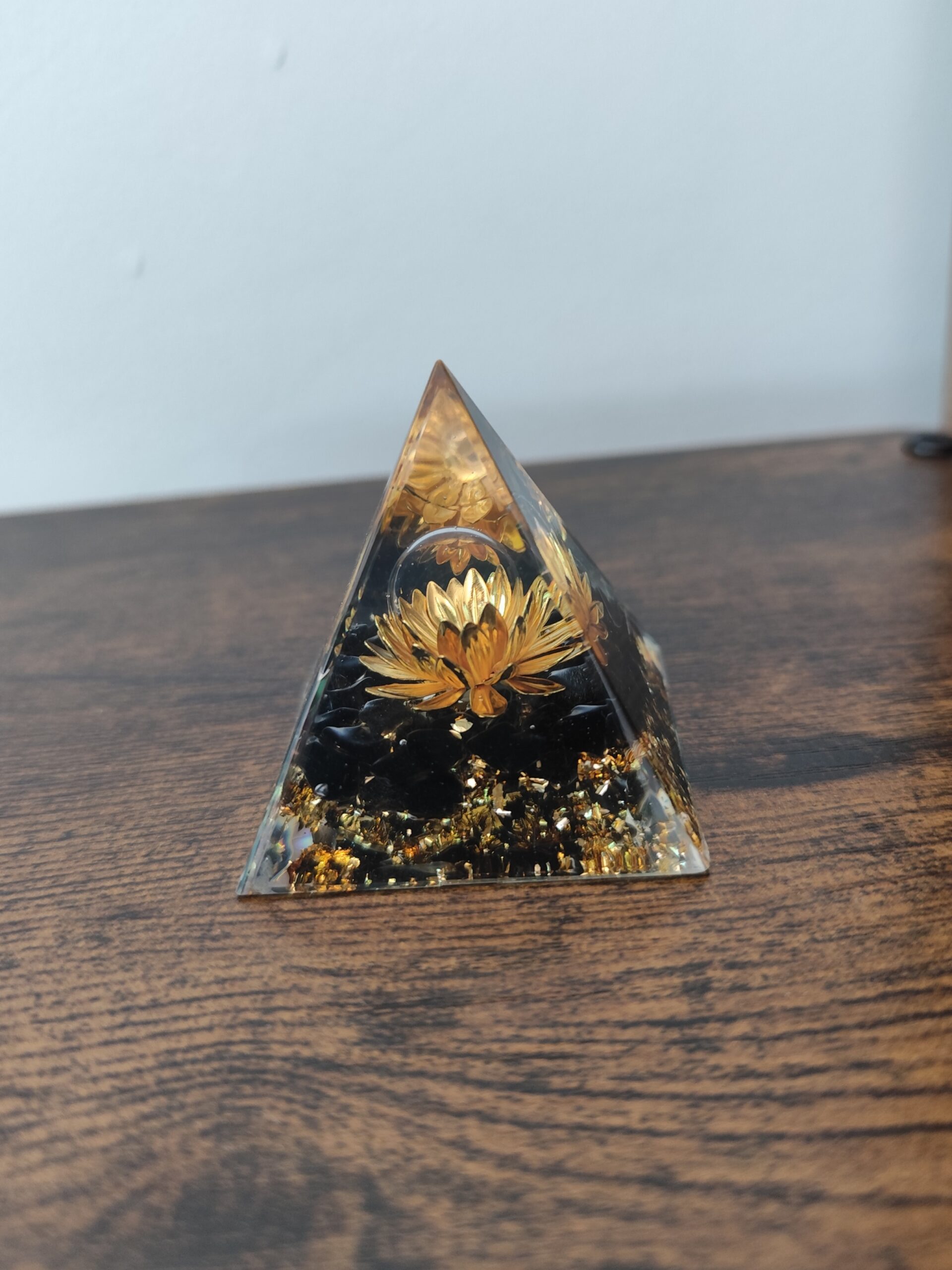 5 x 5 cm handmade golden lotus orgonite pyramid featuring natural obsidian and decorative metallic details