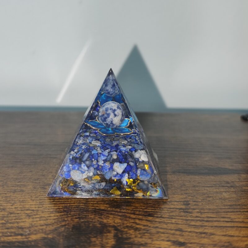 Blue lapis lazuli orgonite pyramid handmade in resin with natural stone pieces and golden accents