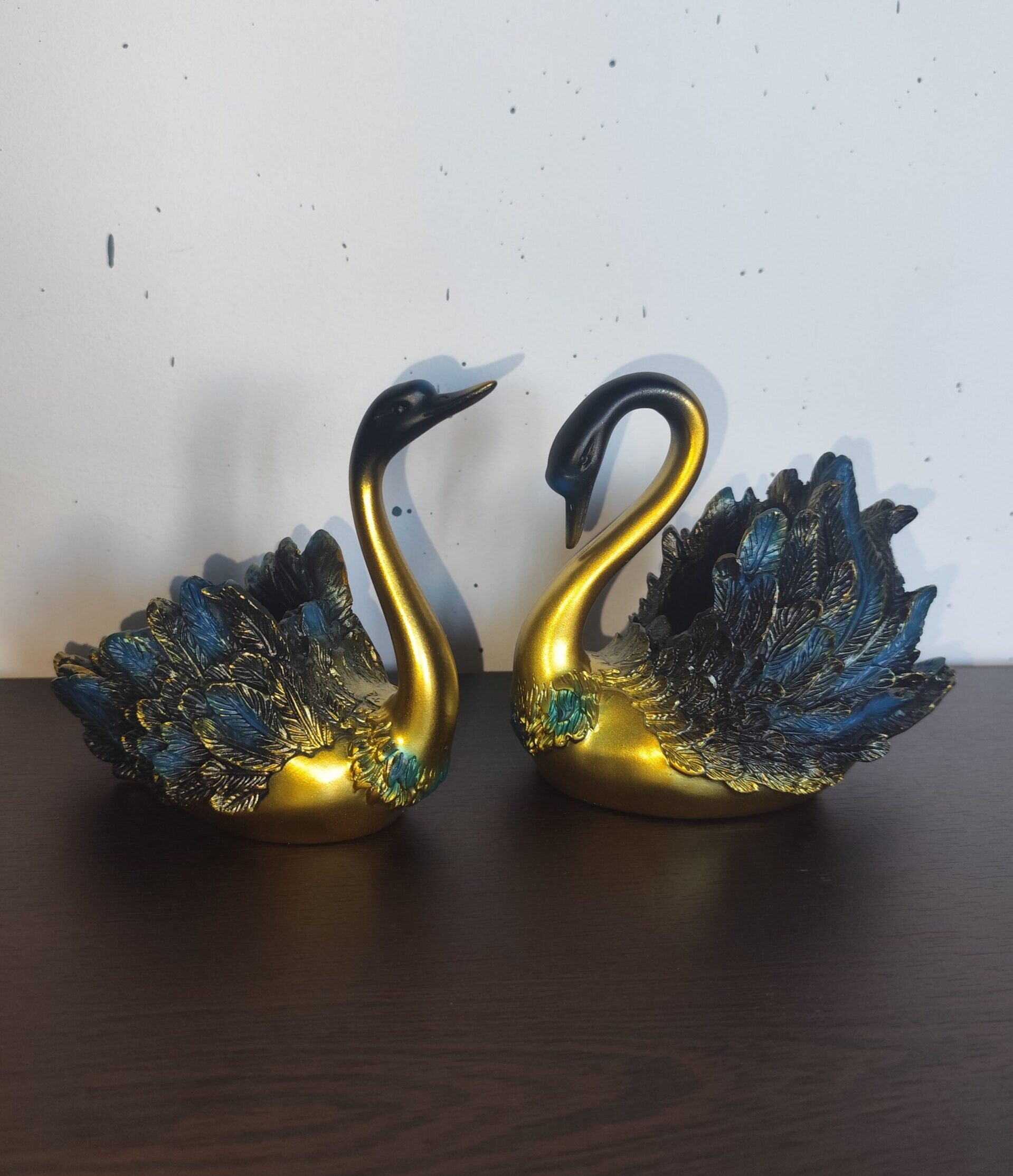 Gold resin swan figurines with blue and black feathers and jewelry holder