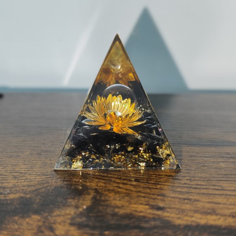 Golden Lotus orgonite pyramid with natural obsidian and metallic accents, handmade in resin