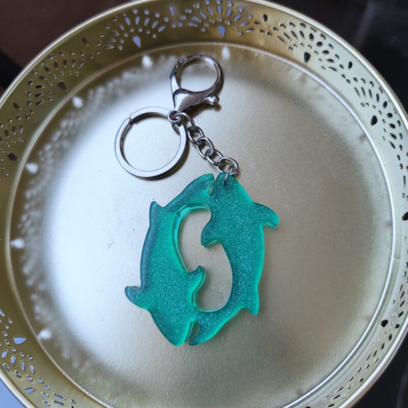Handmade Pisces zodiac fish keychain in green epoxy resin with glitter