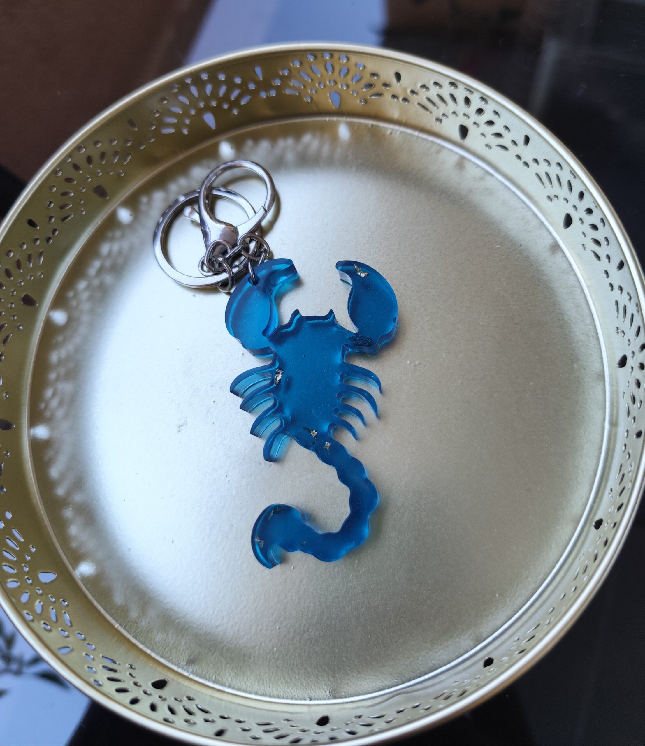 Handmade Scorpio zodiac scorpion keychain in dark blue epoxy resin with gold glitter