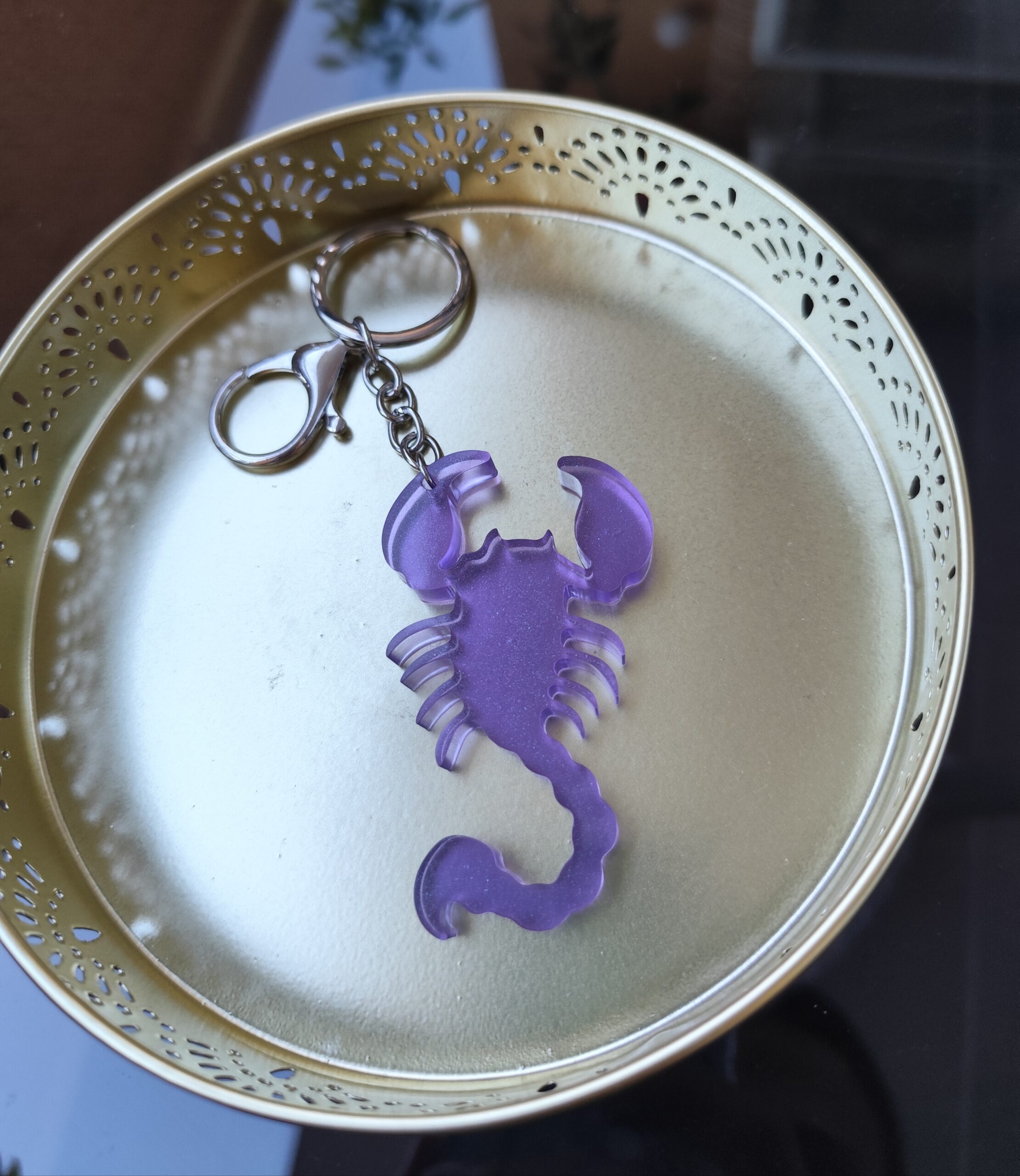 Handmade Scorpio zodiac scorpion keychain in purple epoxy resin