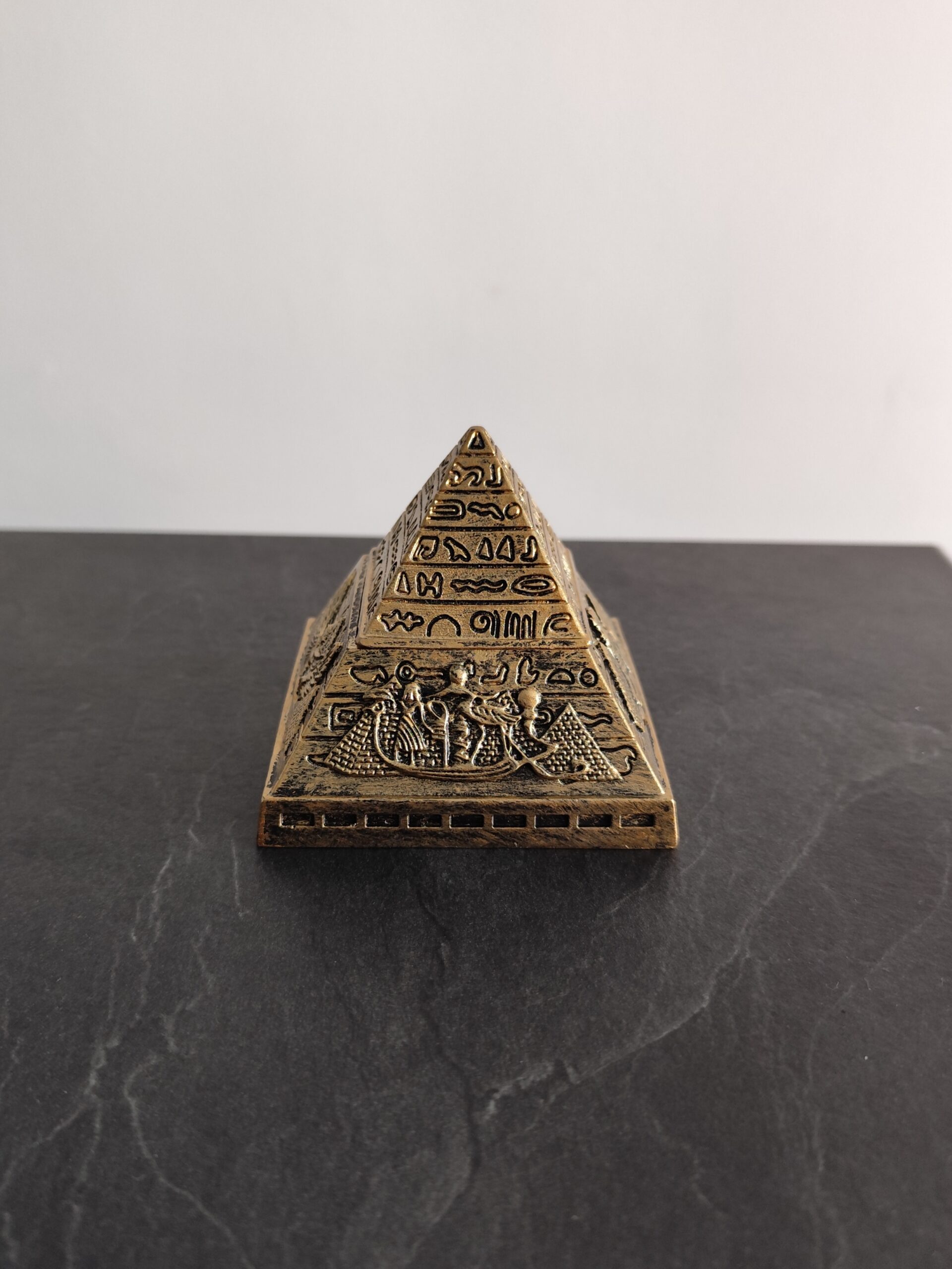 Egyptian pyramid figurine with hieroglyphic details in antique gold finish